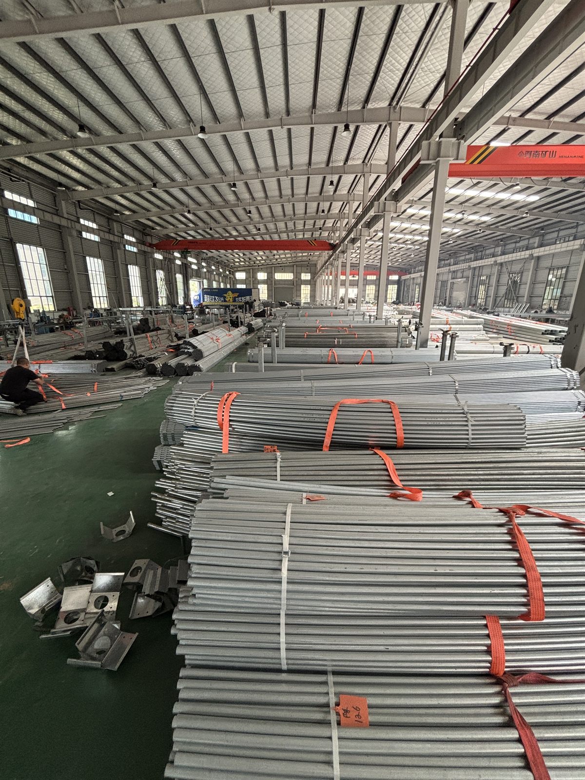 Cut galvanized pipes stored and labeled in greenhouse factory