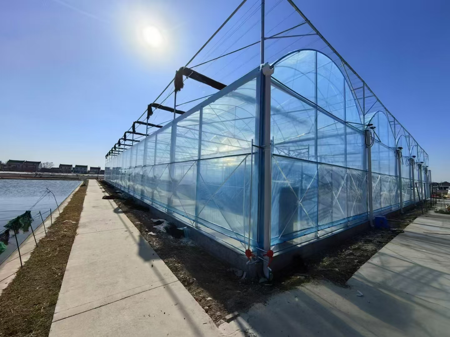 Multi-span film greenhouse corner
